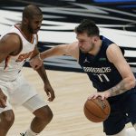 Dallas Mavericks guard Luka Doncic (77) drives with the ball against Phoenix Suns guard Chris Paul, left, during the second half of Game 6 of an NBA basketball second-round playoff series, Thursday, May 12, 2022, in Dallas. (AP Photo/Tony Gutierrez)