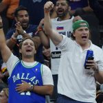 Dallas Mavericks fans cheer during the second half of Game 7 of an NBA basketball Western Conference playoff semifinal against the Phoenix Suns, Sunday, May 15, 2022, in Phoenix. The Mavericks defeated the Suns 123-90. (AP Photo/Matt York)