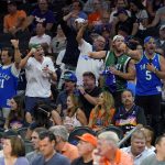 Dallas Mavericks fans cheer during the second half of Game 7 of an NBA basketball Western Conference playoff semifinal against the Phoenix Suns, Sunday, May 15, 2022, in Phoenix. The Mavericks defeated the Suns 123-90. (AP Photo/Matt York)