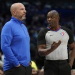 Dallas Mavericks head coach Jason Kidd, left, talks with referee Courtney Kirkland (61) during the first half of Game 6 of an NBA basketball second-round playoff series against the Phoenix Suns, Thursday, May 12, 2022, in Dallas. (AP Photo/Tony Gutierrez)