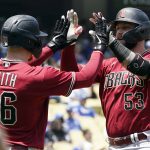 Arizona Diamondbacks' Christian Walker (53) celebrates his two-run home run with Pavin Smith (26) during the third inning of a baseball game against the Los Angeles Dodgers Tuesday, May 17, 2022, in Los Angeles. (AP Photo/Marcio Jose Sanchez)