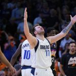 Dallas Mavericks guard Luka Doncic (77) reacts to a play during the first half of Game 2 in the second round of the NBA Western Conference playoff series against the Phoenix Suns, Wednesday, May 4, 2022, in Phoenix. (AP Photo/Matt York)