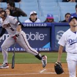 Arizona Diamondbacks' Jordan Luplow, left, heads to first as he hits a solo home run, as Los Angeles Dodgers starting pitcher Tyler Anderson watches during the first inning of a baseball game Tuesday, May 17, 2022, in Los Angeles. (AP Photo/Mark J. Terrill)