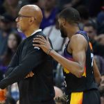 Phoenix Suns forward Mikal Bridges greets head coach Monty Williams as he leaves the game during the second half of Game 7 of an NBA basketball Western Conference playoff semifinal against the Dallas Mavericks, Sunday, May 15, 2022, in Phoenix. The Mavericks defeated the Suns 123-90. (AP Photo/Matt York)