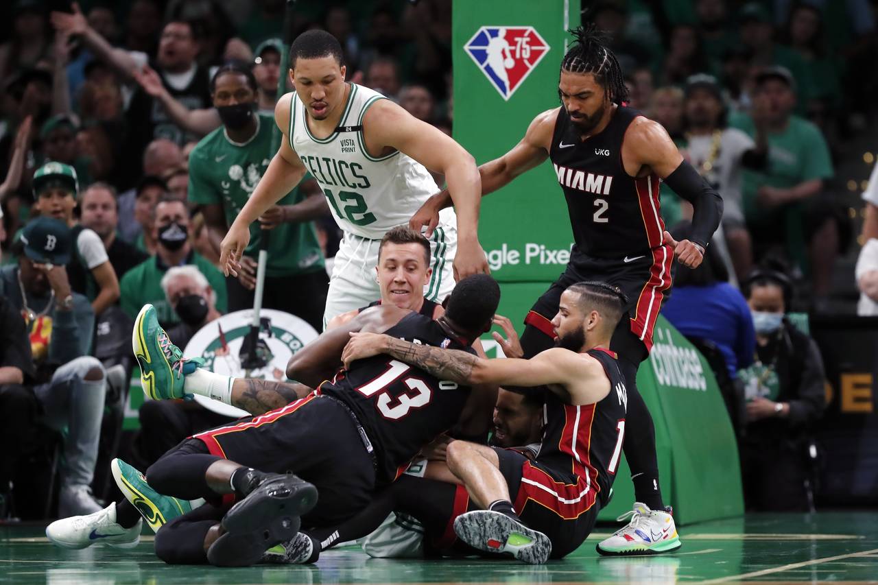 Boston Celtics' Grant Williams (12) and Miami Heat's Gabe Vincent (2) watch as players scramble for...