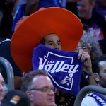 A Phoenix Suns fan watches during the second half of Game 7 of an NBA basketball Western Conference playoff semifinal against the Dallas Mavericks, Sunday, May 15, 2022, in Phoenix. The Mavericks defeated the Suns 123-90. (AP Photo/Matt York)