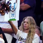 A Phoenix Suns fan holds up a sign showing Dallas Mavericks' Luka Doncic crying during the second half of Game 5 of an NBA basketball second-round playoff series Tuesday, May 10, 2022, in Phoenix. The Suns won 110-80. (AP Photo/Ross D. Franklin)