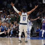 Dallas Mavericks guard Jalen Brunson (13) reacts to a play during the first half of Game 3 of an NBA basketball second-round playoff series against the Phoenix Suns, Friday, May 6, 2022, in Dallas. (AP Photo/Tony Gutierrez)