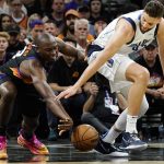 Phoenix Suns center Bismack Biyombo, left, battles with Dallas Mavericks forward Maxi Kleber, right, for a loose ball during the second half of Game 5 of an NBA basketball second-round playoff series Tuesday, May 10, 2022, in Phoenix. The Suns won 110-80. (AP Photo/Ross D. Franklin)
