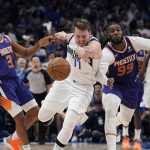 Dallas Mavericks guard Luka Doncic (77) battles Phoenix Suns forward Jae Crowder (99) and guard Chris Paul (3) for a loose ball during the second half of Game 3 of an NBA basketball second-round playoff series, Friday, May 6, 2022, in Dallas. (AP Photo/Tony Gutierrez)