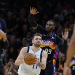 Dallas Mavericks guard Luka Doncic (77) drives to the basket past Phoenix Suns forward Jae Crowder (99) during the first half of Game 2 in the second round of the NBA Western Conference playoff series Wednesday, May 4, 2022, in Phoenix. (AP Photo/Matt York)
