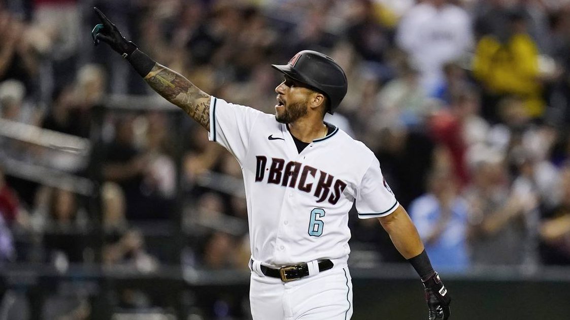 Arizona Diamondbacks' David Peralta points to the crowd as he rounds the bases after hitting a home...