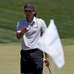 Arizona State golfer Cameron Sisk motions for his ball to stop on the second green during the semifinal round of the NCAA college men's match play golf championship, Tuesday, May 31, 2022, in Scottsdale, Ariz. (AP Photo/Matt York)
