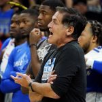 Dallas Mavericks owner Mark Cuban shouts as he stands on the court during the second half of Game 5 of an NBA basketball second-round playoff series against the Phoenix Suns Tuesday, May 10, 2022, in Phoenix. The Suns won 110-80. (AP Photo/Ross D. Franklin)