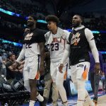 Phoenix Suns players walk off the court after their loss to the Dallas Mavericks in Game 6 of an NBA basketball second-round playoff series, Thursday, May 12, 2022, in Dallas. (AP Photo/Tony Gutierrez)