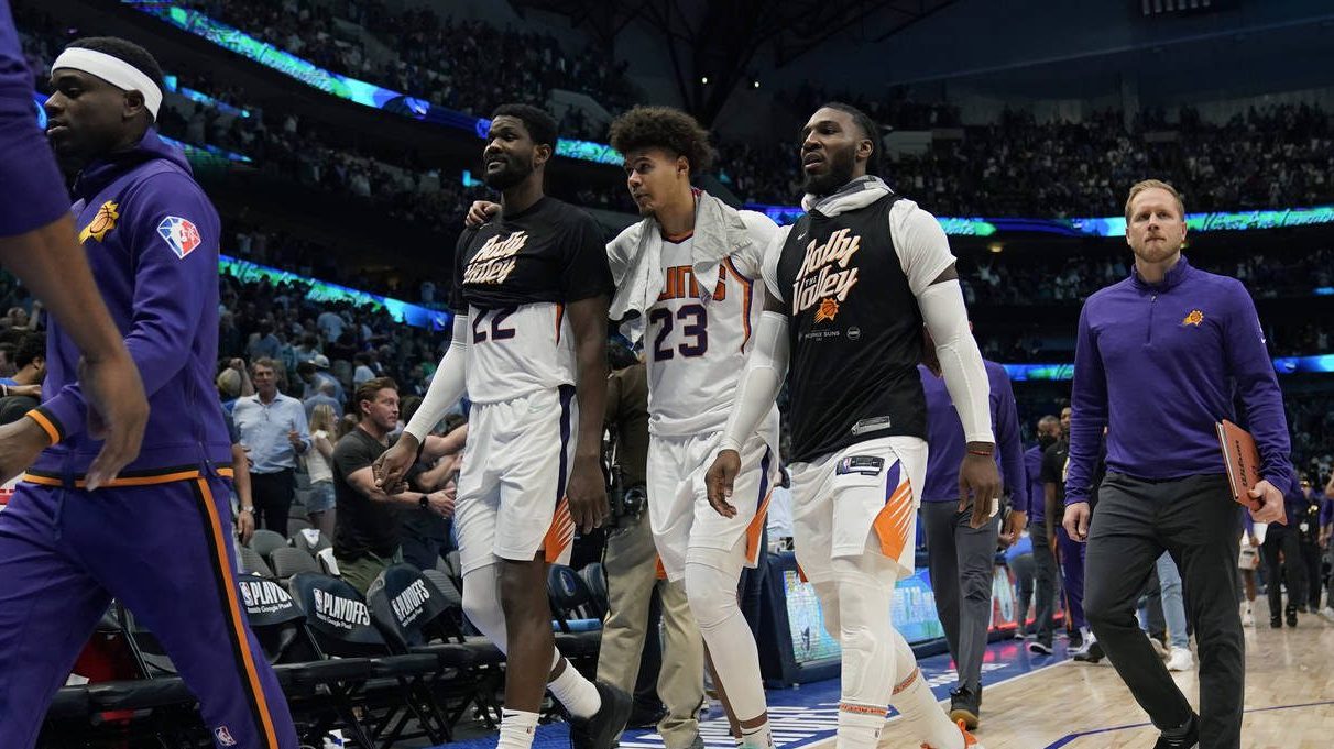 Phoenix Suns players walk off the court after their loss to the Dallas Mavericks in Game 6 of an NB...