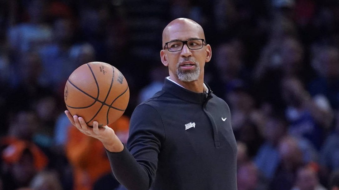 Phoenix Suns head coach Monty Williams hands off the ball during a break in the action during the f...