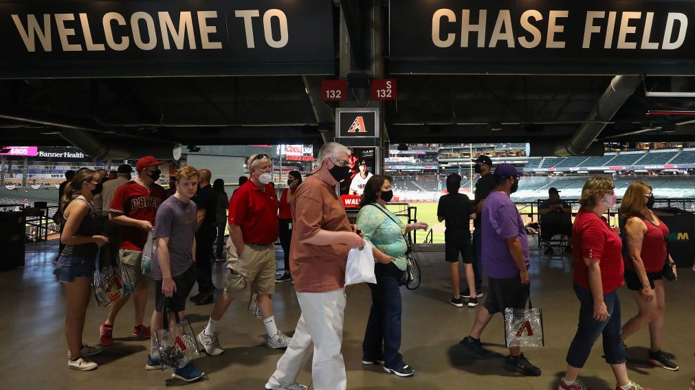 Fans walk the concourse before the MLB game between the Arizona Diamondbacks and the Cincinnati Red...