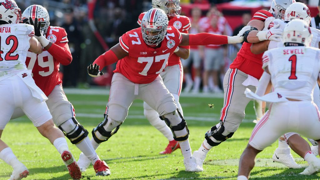 Ohio State Buckeyes offensive lineman Paris Johnson Jr. (77) protects his quarterback during the fi...