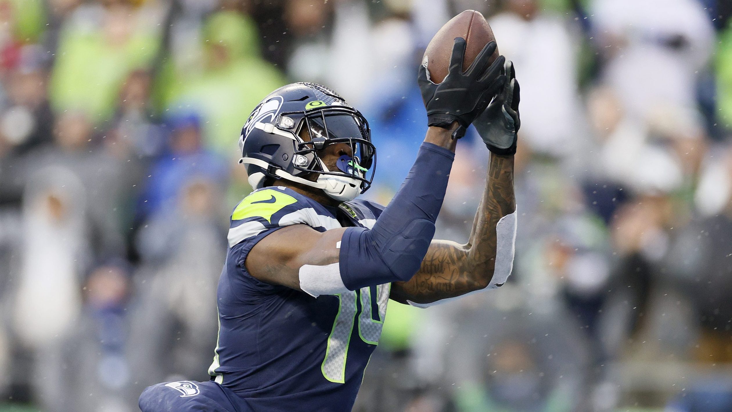 DK Metcalf #14 of the Seattle Seahawks catches a pass for a touchdown against the Detroit Lions dur...