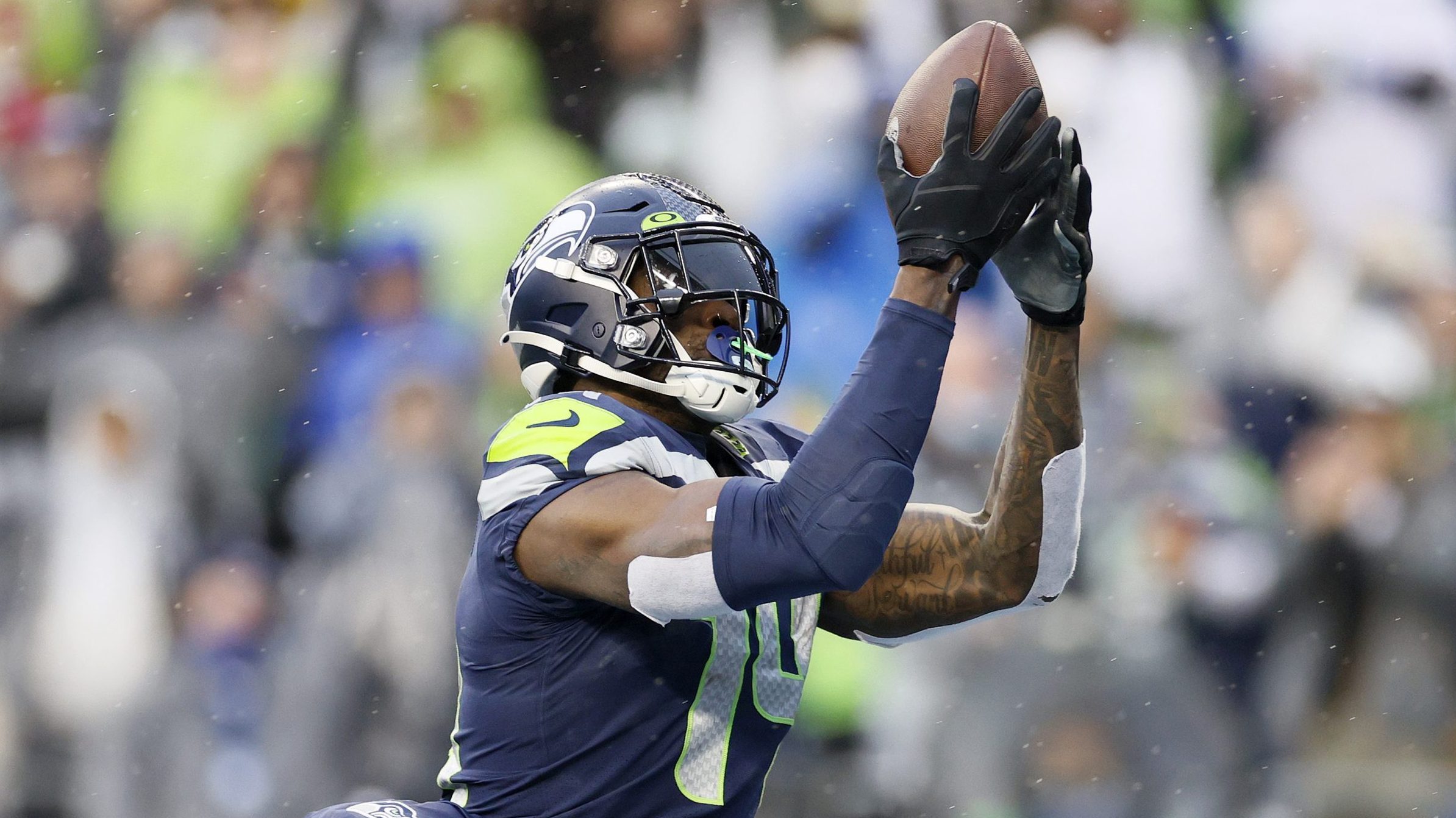 DK Metcalf #14 of the Seattle Seahawks catches a pass for a touchdown against the Detroit Lions dur...