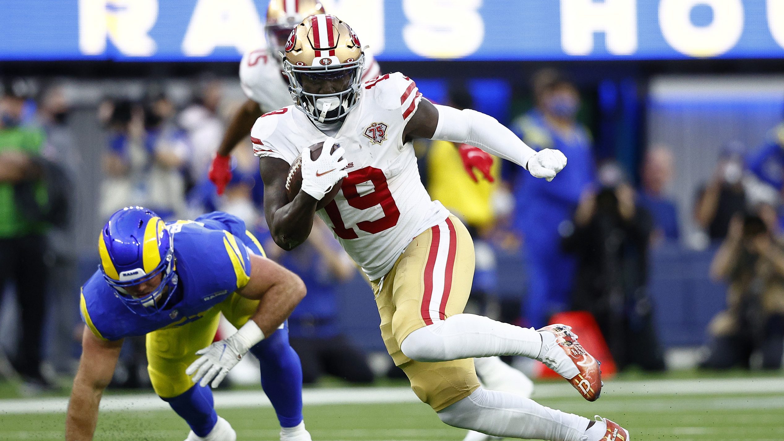 Deebo Samuel #19 of the San Francisco 49ers runs with the ball during the game against the Los Ange...