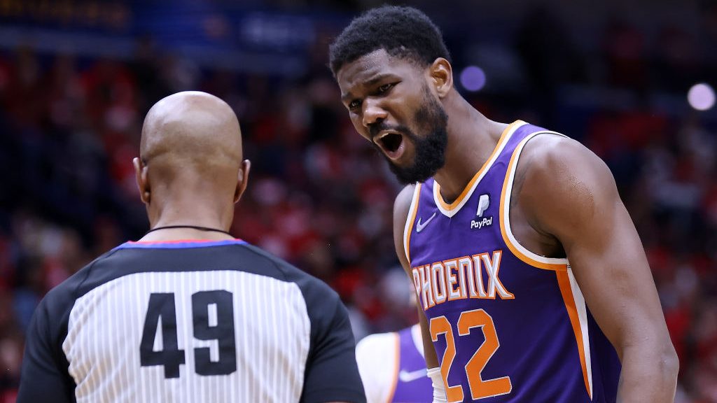 Deandre Ayton #22 of the Phoenix Suns talks to referee Tom Washington #49 during the second half of...