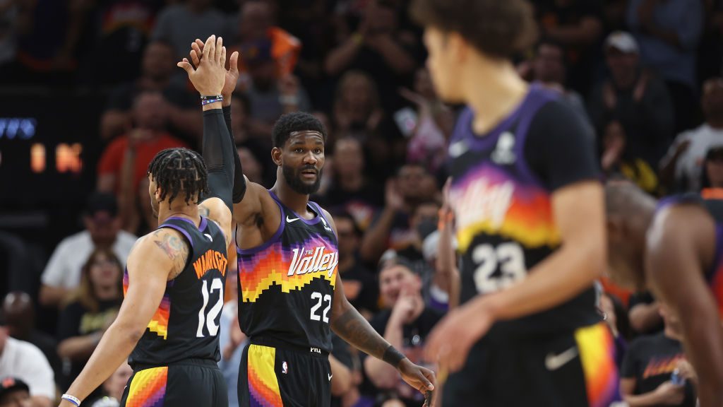 Deandre Ayton #22 of the Phoenix Suns high fives Ish Wainright #12 after scoring against the Dallas...