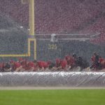 Members of the grounds crew roll the tarp onto the field during a rain delay in the seventh inning of the game between the Arizona Diamondbacks and the Cincinnati Reds at Great American Ball Park on June 06, 2022 in Cincinnati, Ohio. (Photo by Dylan Buell/Getty Images)