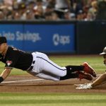 Josh Rojas #10 of the Arizona Diamondbacks dives to third base to get the force out on CJ Abrams #77 of the San Diego Padres on a ground ball hit by Austin Nola #26 during the third inning at Chase Field on June 29, 2022 in Phoenix, Arizona. (Photo by Norm Hall/Getty Images)