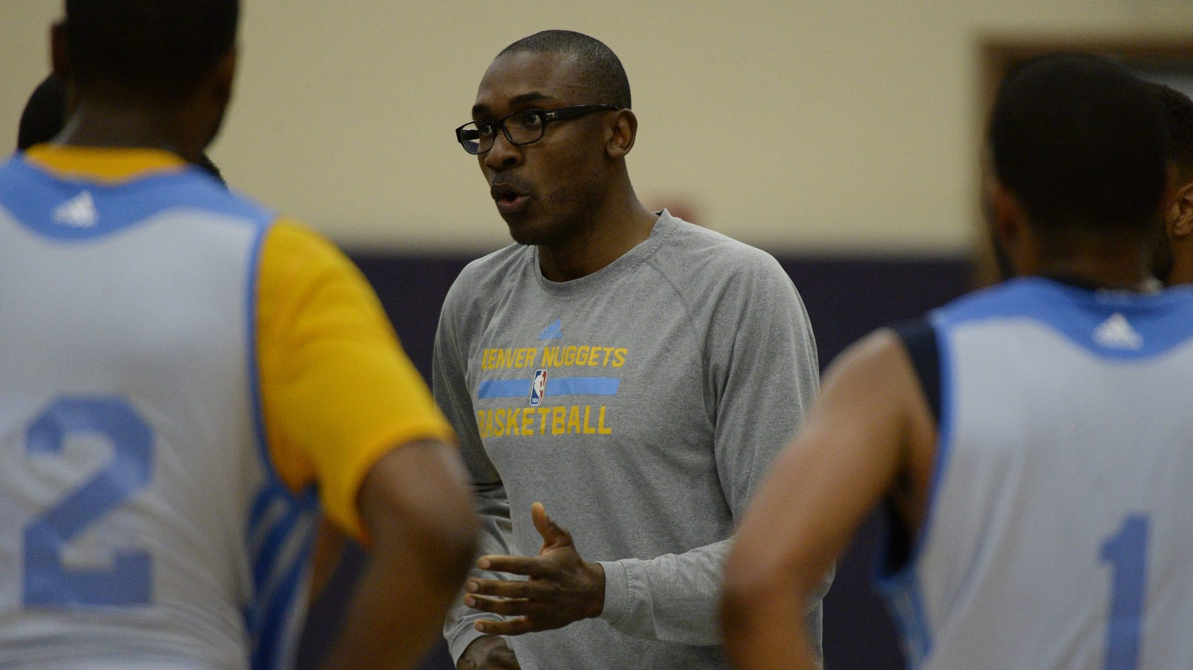 Denver Nuggets assistant coach Patrick Mutombo talks to the team during practice July 8, 2014 at Pe...