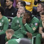 Boston Celtics players react from the bench during the second half of Game 5 of basketball's NBA Finals against the Golden State Warriors in San Francisco, Monday, June 13, 2022. (AP Photo/Jed Jacobsohn)