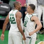Boston Celtics center Al Horford (42) and forward Grant Williams (12) react during the third quarter of Game 6 of basketball's NBA Finals against the Golden State Warriors, Thursday, June 16, 2022, in Boston. (AP Photo/Steven Senne)