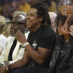 Jay-Z watches during the first half of Game 5 of basketball's NBA Finals between the Golden State Warriors and the Boston Celtics in San Francisco, Monday, June 13, 2022. (AP Photo/Jed Jacobsohn)
