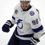 Tampa Bay Lightning defenseman Mikhail Sergachev celebrates his goal against the Colorado Avalanche during the second period of Game 1 of the NHL hockey Stanley Cup Final on Wednesday, June 15, 2022, in Denver. (AP Photo/David Zalubowski)