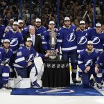 Members of the Tampa Bay Lightning pose with the Prince of Wales trophy after defeating the New York Rangers Game 6 of the NHL hockey Stanley Cup playoffs Eastern Conference finals Saturday, June 11, 2022, in Tampa, Fla. The Lightning advanced to the Stanley Cup Finals. (AP Photo/Chris O'Meara)