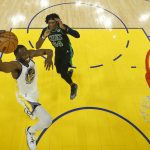 Golden State Warriors forward Draymond Green (23) shoots against Boston Celtics center Robert Williams III during the first half of Game 5 of basketball's NBA Finals in San Francisco, Monday, June 13, 2022. (AP Photo/Jed Jacobsohn, Pool)
