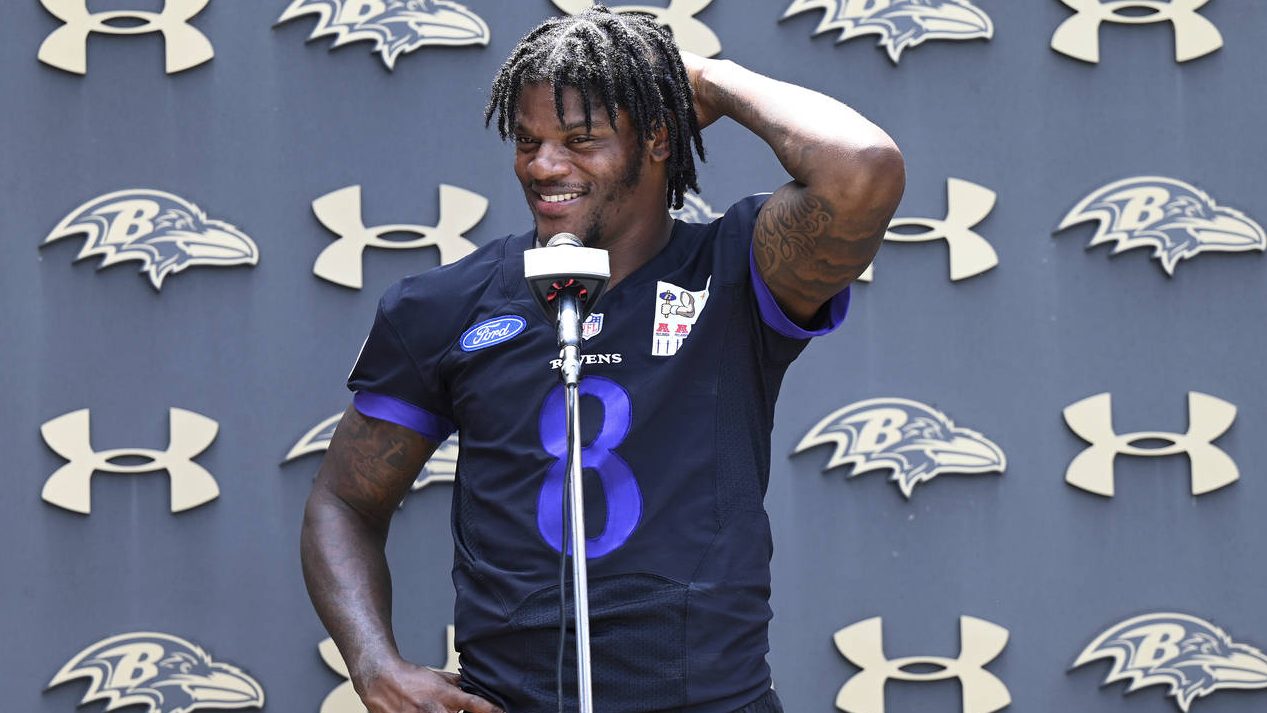 Baltimore Ravens quarterback Lamar Jackson answers questions from the media after NFL football team...