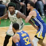 Boston Celtics guard Marcus Smart (36) prepares to drive against Golden State Warriors guard Stephen Curry (30) during the first quarter of Game 6 of basketball's NBA Finals, Thursday, June 16, 2022, in Boston. (AP Photo/Steven Senne)