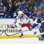 New York Rangers center Frank Vatrano (77) and Tampa Bay Lightning defenseman Victor Hedman (77) vie for the puck during the first period in Game 6 of the NHL hockey Stanley Cup playoffs Eastern Conference finals, Saturday, June 11, 2022, in Tampa, Fla. (Chris O'Meara)