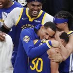 Golden State Warriors guard Stephen Curry (30) celebrates with teammates after beating the Boston Celtics in Game 6 to win basketball's NBA Finals, Thursday, June 16, 2022, in Boston. (AP Photo/Michael Dwyer)