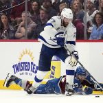 Tampa Bay Lightning defenseman Victor Hedman, top, vies for puck next to Colorado Avalanche right wing Logan O'Connor (25) during the third period of Game 1 of the NHL hockey Stanley Cup Final on Wednesday, June 15, 2022, in Denver. (AP Photo/John Locher)