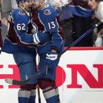 Colorado Avalanche left wing Artturi Lehkonen (62) and Valeri Nichushkin (13) celebrate the team's overtime win against the Tampa Bay Lightning in Game 1 of the NHL hockey Stanley Cup Final on Wednesday, June 15, 2022, in Denver. (AP Photo/John Locher)