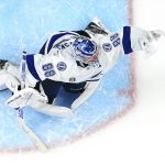 Tampa Bay Lightning goaltender Andrei Vasilevskiy reaches for a Colorado Avalanche shot during the third period of Game 1 of the NHL hockey Stanley Cup Final on Wednesday, June 15, 2022, in Denver. (AP Photo/John Locher)