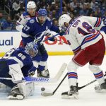 Tampa Bay Lightning goaltender Andrei Vasilevskiy (88) stops a shot by New York Rangers center Andrew Copp (18) during the third period in Game 6 of the NHL hockey Stanley Cup playoffs Eastern Conference finals Saturday, June 11, 2022, in Tampa, Fla. (AP Photo/Chris O'Meara)