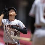 Arizona Diamondbacks' Pavin Smith points skyward as he crosses home plate after hitting a solo home run during the fifth inning of a baseball game against the Cincinnati Reds in Cincinnati, Thursday, June 9, 2022. (AP Photo/Aaron Doster)
