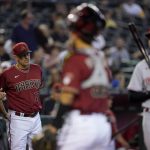 Arizona Diamondbacks' manager Torey Lovullo (17) argues a call with home plate umpire Nick Mahrley during the second inning of a baseball game, Wednesday, June 15, 2022, in Phoenix. (AP Photo/Matt York)