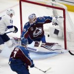 Tampa Bay Lightning left wing Ondrej Palat, left, scores past Colorado Avalanche goaltender Darcy Kuemper during the second period of Game 1 of the NHL hockey Stanley Cup Final on Wednesday, June 15, 2022, in Denver. (AP Photo/David Zalubowski)