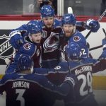 Colorado Avalanche right wing Valeri Nichushkin (13) celebrates his goal against the Tampa Bay Lightning with teammates during the first period of Game 1 of the NHL hockey Stanley Cup Final on Wednesday, June 15, 2022, in Denver. (AP Photo/David Zalubowski)