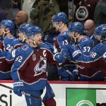 Colorado Avalanche left wing Gabriel Landeskog (92) is congratulated for his goal against the Tampa Bay Lightning during the first period of Game 1 of the NHL hockey Stanley Cup Final on Wednesday, June 15, 2022, in Denver. (AP Photo/John Locher)